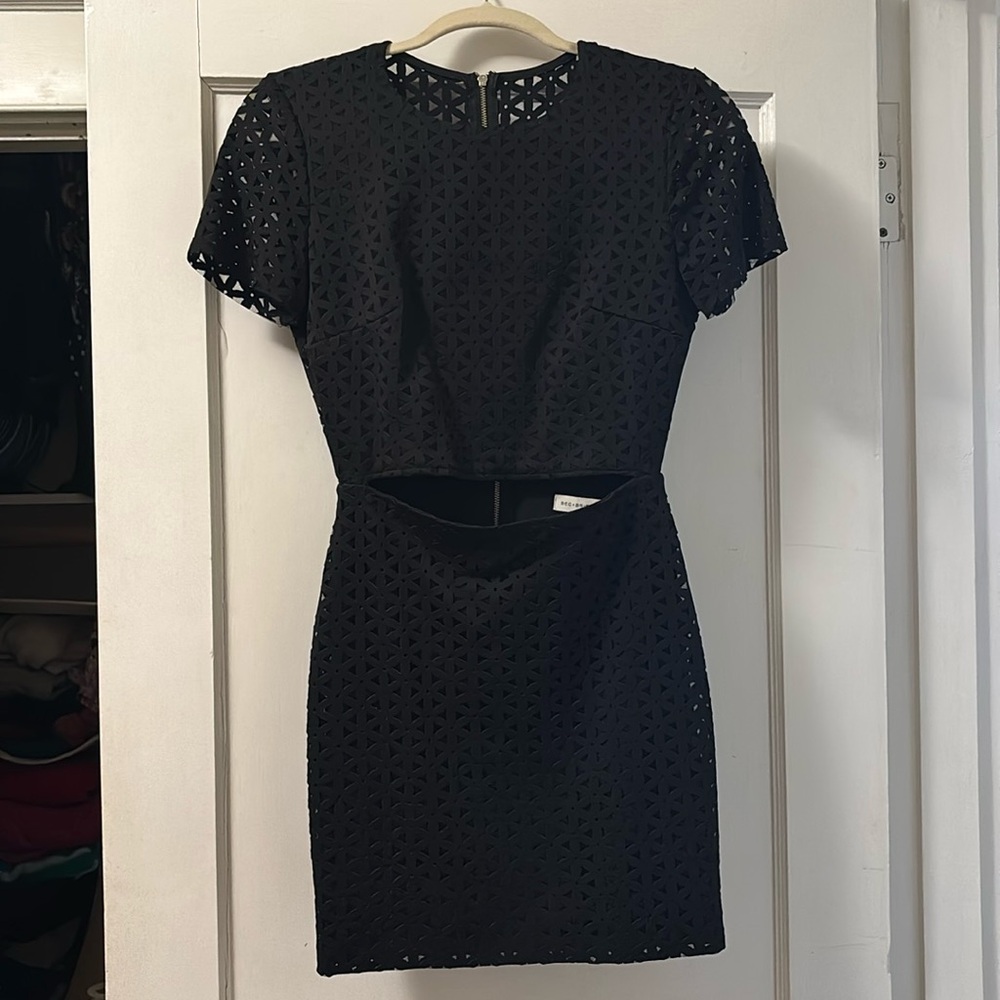 Geometric black cocktail dress with midriff peekaboo